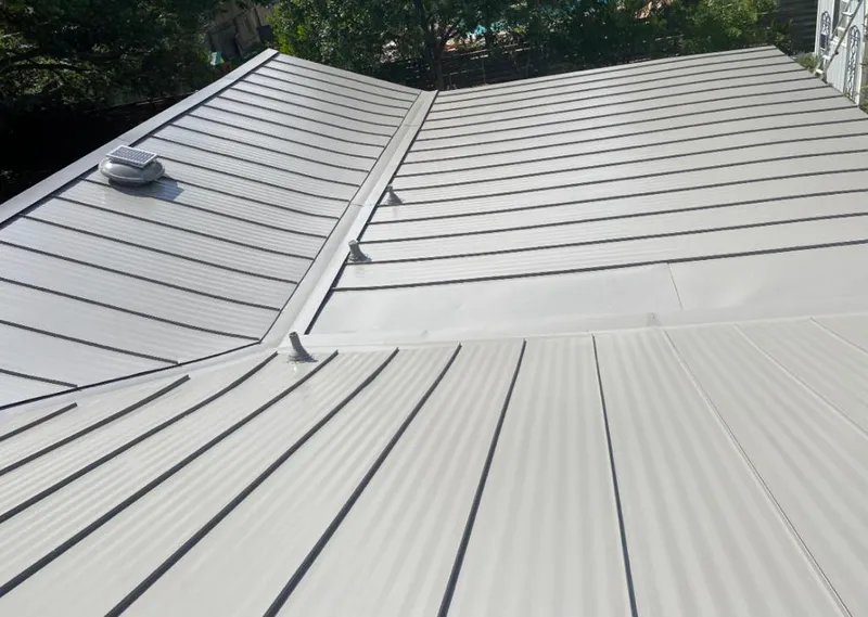 Solar attic fan installed on a metal roof for Roof Ventilation in Fort Washington